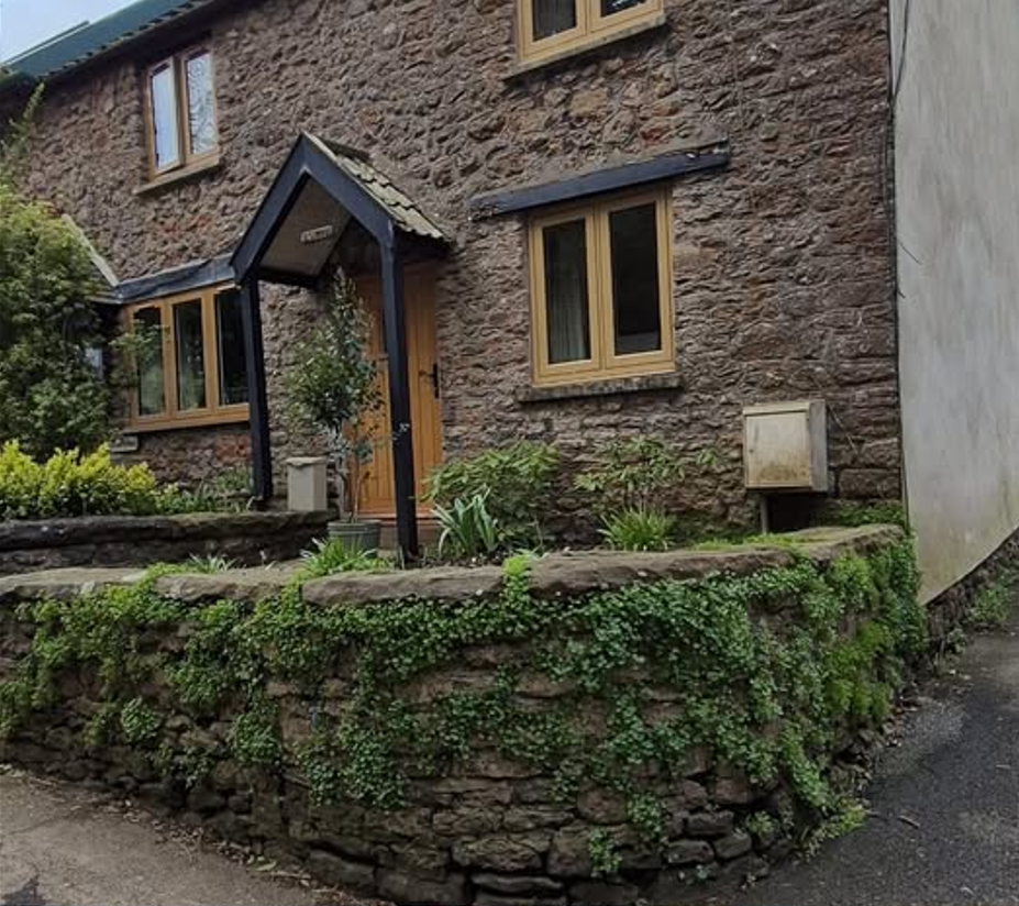 Stone wall before brickwork repointing
